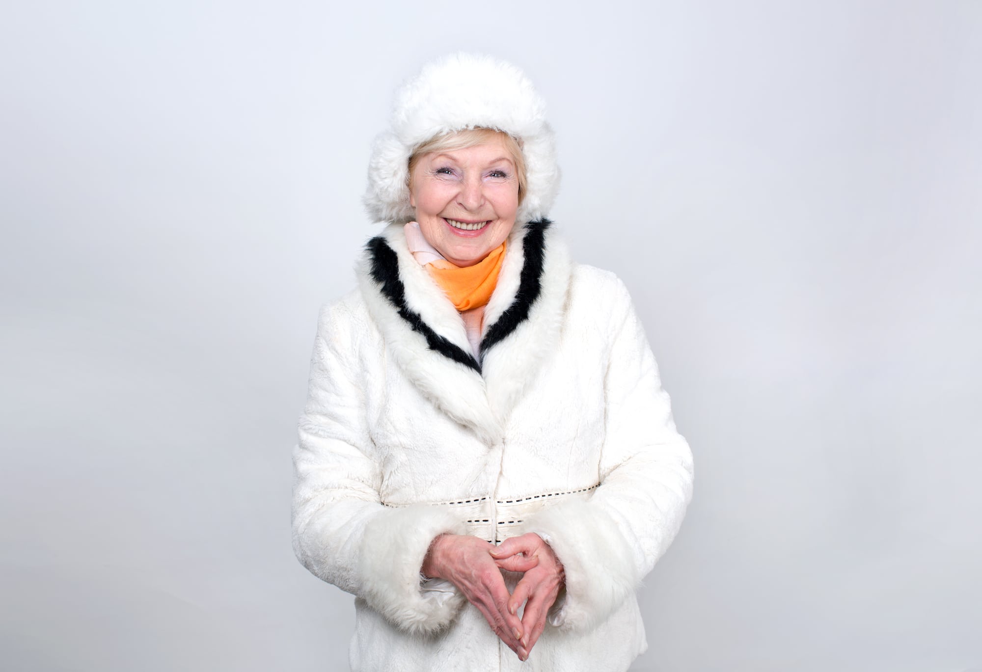 Smiling senior woman dressed in winter outerwear